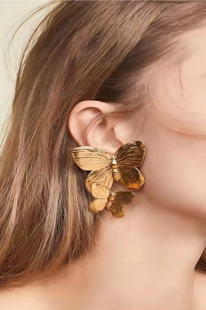 Nahaufnahme eines Schmetterling-Ohrhängers - KYMA